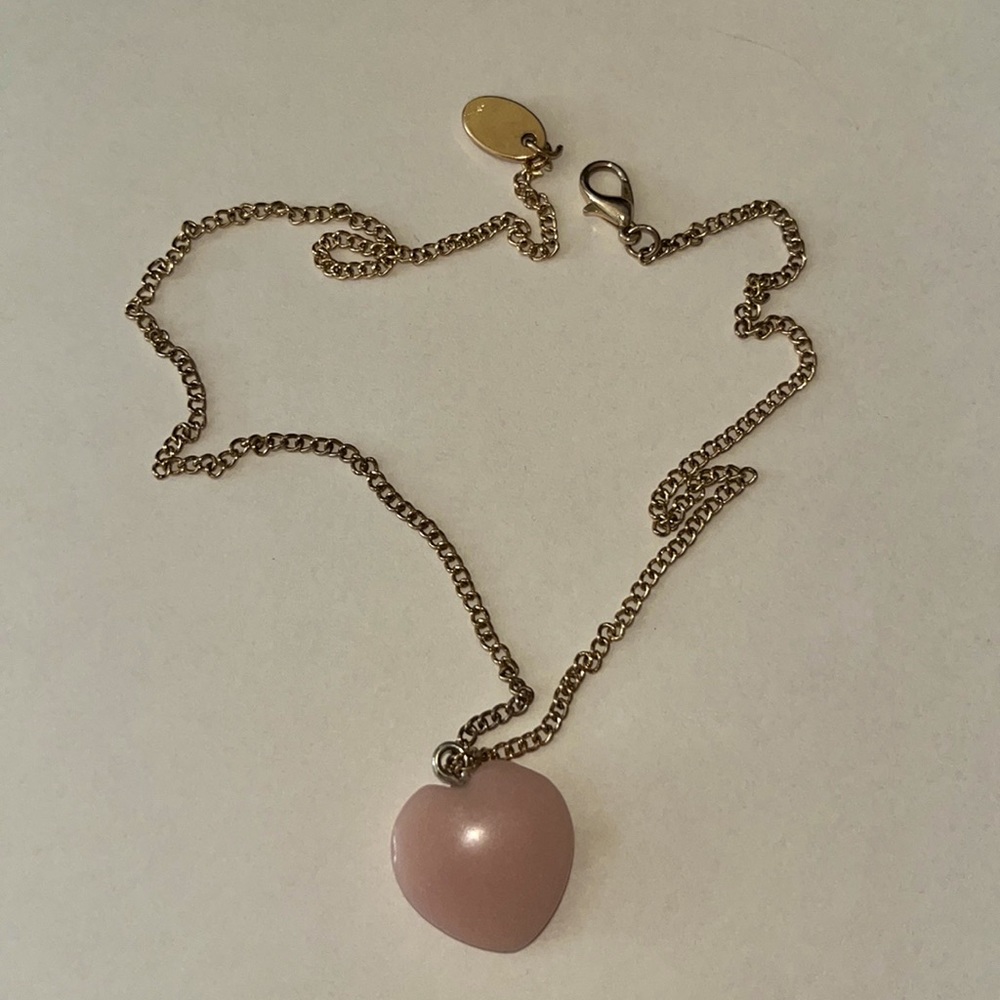 This is a baby pink heart pendant that I made on a necklace it was handmade